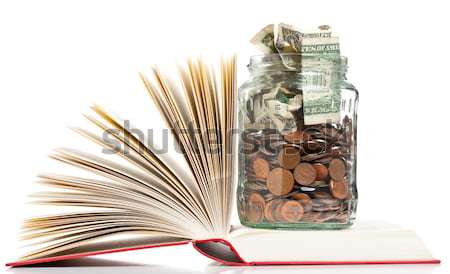 Edukacji finansowanie książek pens jar monet Zdjęcia stock © ShawnHempel