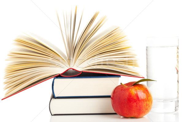 Books with apple and glass of water Stock photo © ShawnHempel