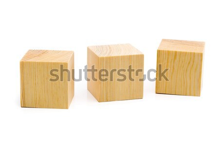 Three brown wooden cubes lined up Stock photo © ShawnHempel