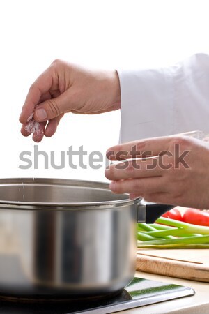 Chef adding pepper Stock photo © ShawnHempel