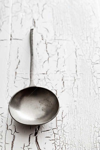 Stock photo: Old silver serving spoon on table