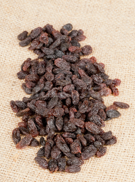Heap of raisins on burlap Stock photo © ShawnHempel