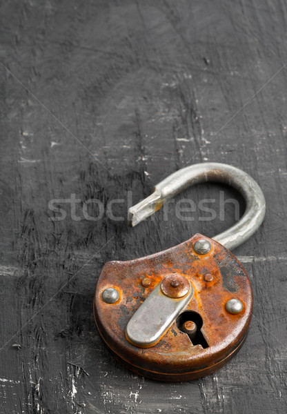 Open antique padlock on black Stock photo © ShawnHempel