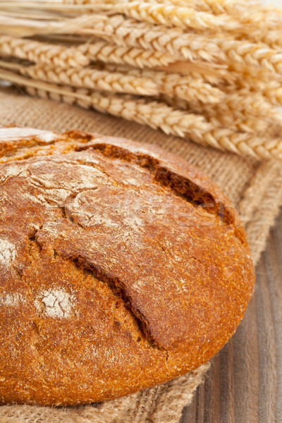 Loaf of bread with wheat ears Stock photo © ShawnHempel