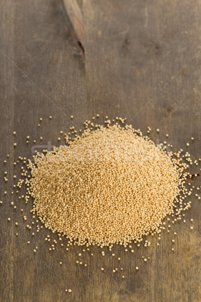 Heap of raw amarath seeds on wooden board Stock photo © ShawnHempel