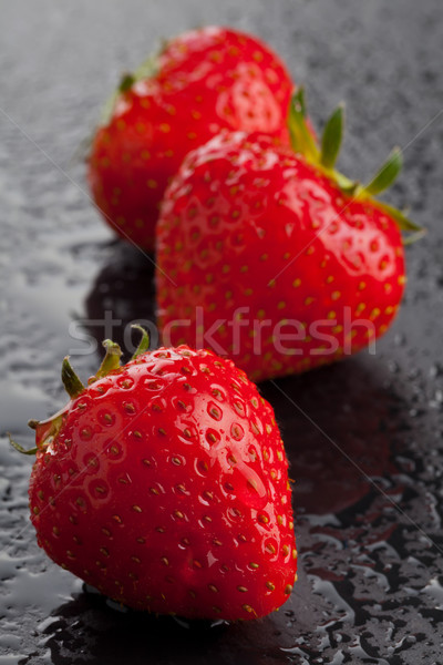 Three strawberries on black Stock photo © ShawnHempel