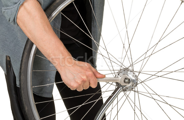 Man repairing front wheel on a bicycle Stock photo © ShawnHempel