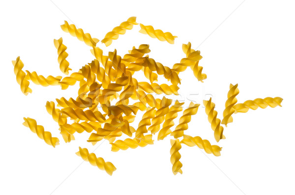 Backlit dried raw, uncooked spirelli pasta noodles Stock photo © ShawnHempel