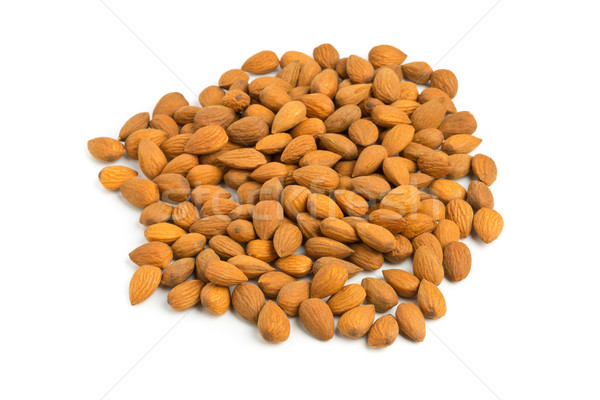 Cracked and shelled almond kernels on white Stock photo © ShawnHempel