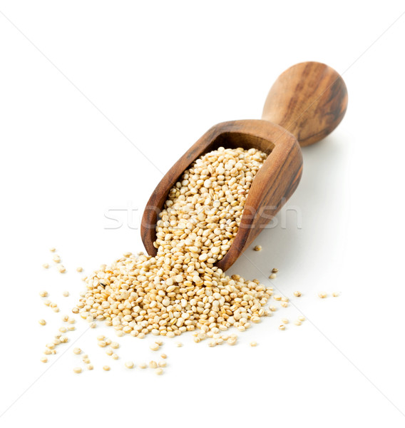 Raw, whole, unprocessed quinoa seed in wooden scoop on white Stock photo © ShawnHempel