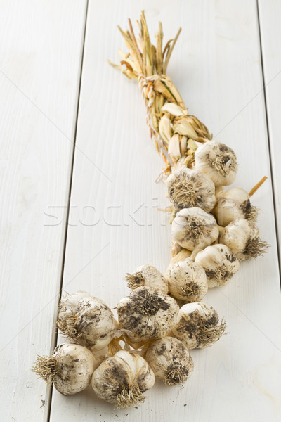 Braided garlic from harvest on table Stock photo © ShawnHempel