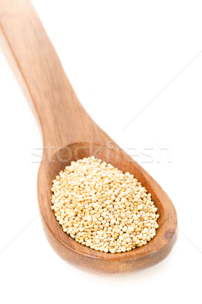 Raw, uncooked, whole quinoa seed in wooden spoon Stock photo © ShawnHempel