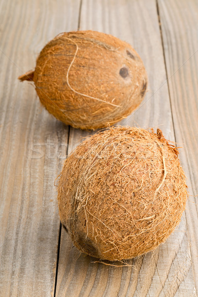 Whole coconuts on table Stock photo © ShawnHempel