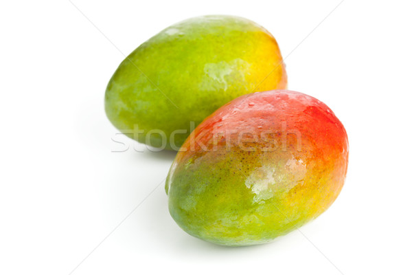Two mangoes over white background Stock photo © ShawnHempel