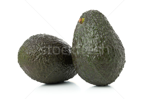 Two whole, uncut ripe avocado fruit Stock photo © ShawnHempel