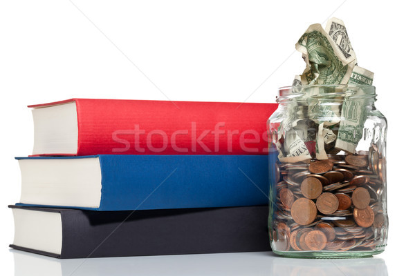 Onderwijs financiering boeken penny jar munten Stockfoto © ShawnHempel