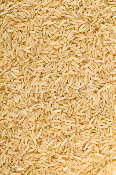 Natural brown uncooked rice frame filling Stock photo © ShawnHempel