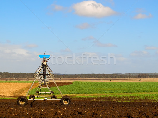 Agriculture Ploughed field with irrigation equipment Stock photo © sherjaca