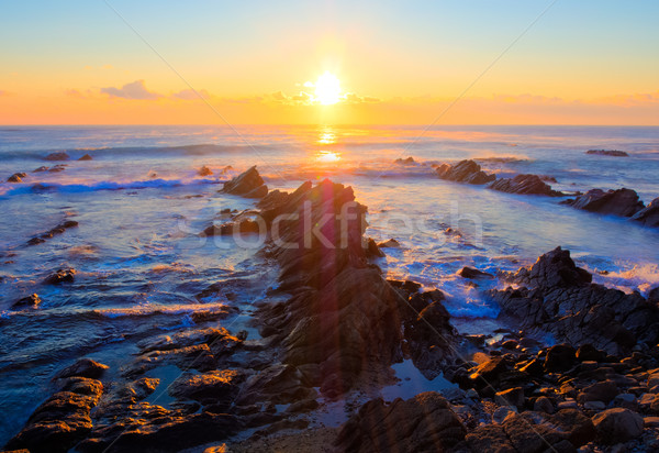 Beautiful sunrise over Cretaceous sedimentary rock coastline Stock photo © shihina