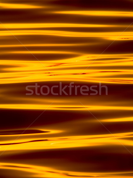 Wavelets on the surface of sunset lake  Stock photo © shihina