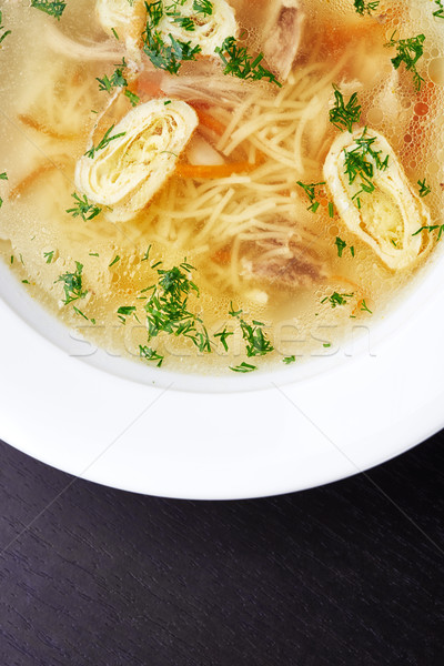 Clear chicken broth with vegetables and noodles Stock photo © shivanetua