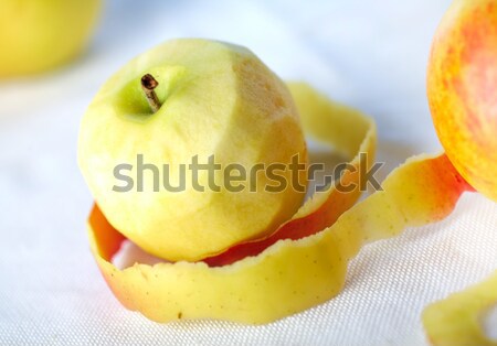 Yellow apple with peeled twisted skin Stock photo © shyshka