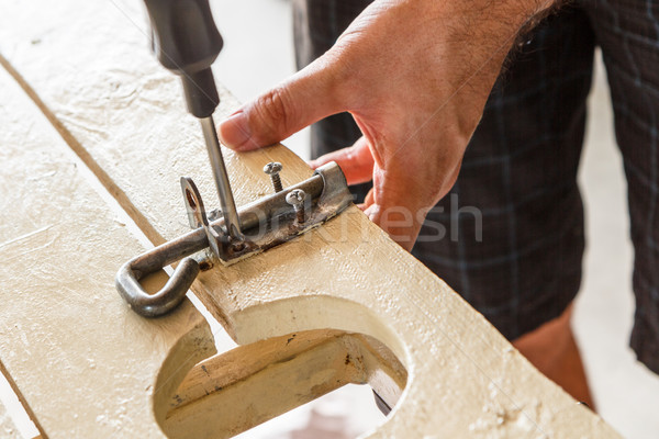 DIY Screwing in Screw Stock photo © silkenphotography