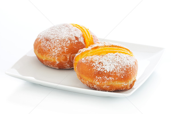 Two Berliner with egg creme on a plate Stock photo © simas2