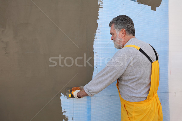 Ház rendbehoz fal szigetelés munkás építkezés Stock fotó © simazoran