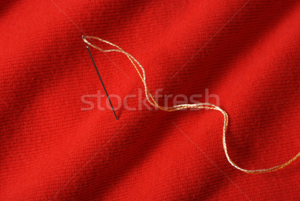 Aiguille fil rouge couleur vêtements Photo stock © simazoran