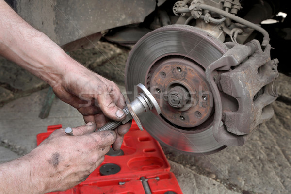 Car mechanic work on disc brakes Stock photo © simazoran