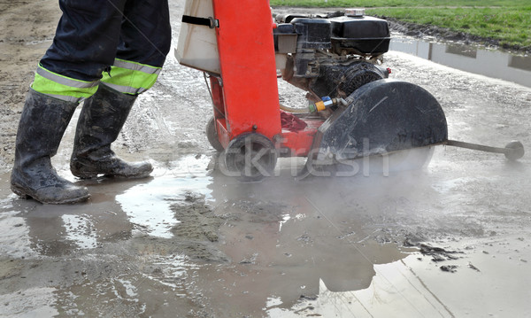 Construction site, asphalt cutting tool at road construction sit Stock photo © simazoran