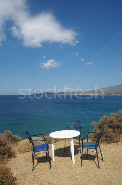 Kust Griekenland eiland tabel stoelen Stockfoto © simazoran