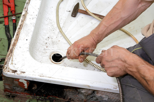 Instalacyjnych hydraulik czyszczenia drenażu łazienka kabel Zdjęcia stock © simazoran