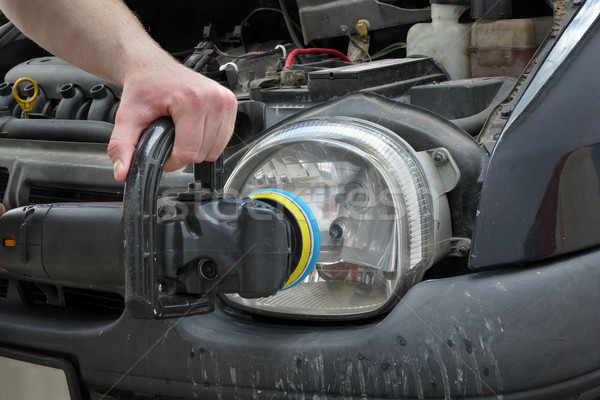 Car light repairing, hand with tool polish headlight Stock photo © simazoran