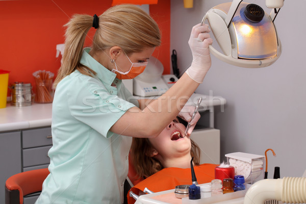 Dental procedure, tooth examine Stock photo © simazoran