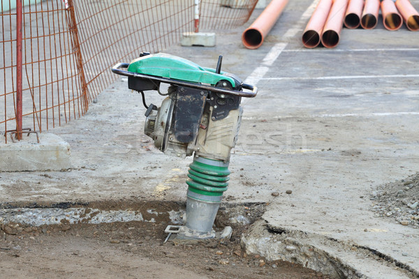 Gasoline or diesel vibratory plate compactor at road constructio Stock photo © simazoran