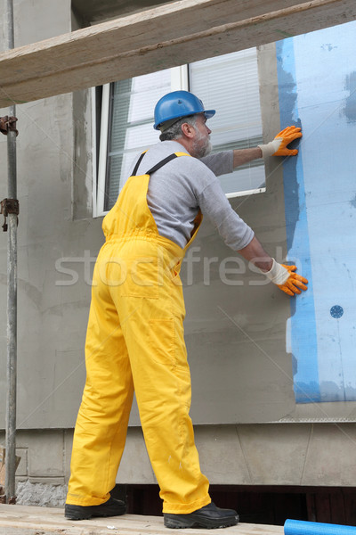 Styrofoam facade insulation, installing mesh Stock photo © simazoran