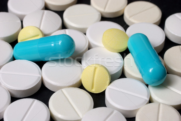 белый синий желтый таблетки здоровья Сток-фото © simazoran