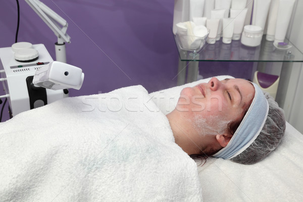 Beauty treatment of young female face, ozone facial steamer Stock photo © simazoran
