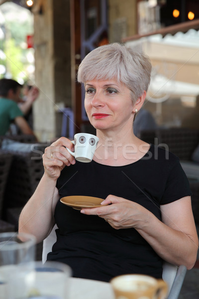 Woman in cafe drinking coffee Stock photo © simazoran