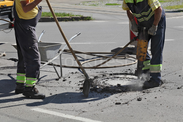 Asphalt demolishing, worker and jackhammer Stock photo © simazoran