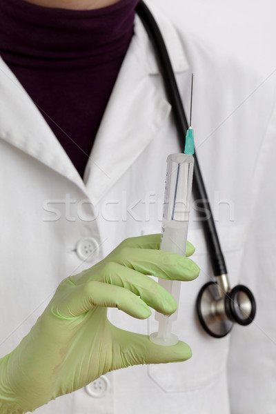 Doctor using syringe Stock photo © simazoran