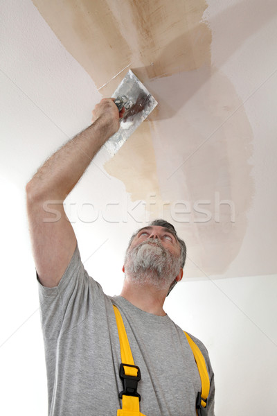 Worker Repairing Plaster At Ceiling Stock Photo C Simazoran