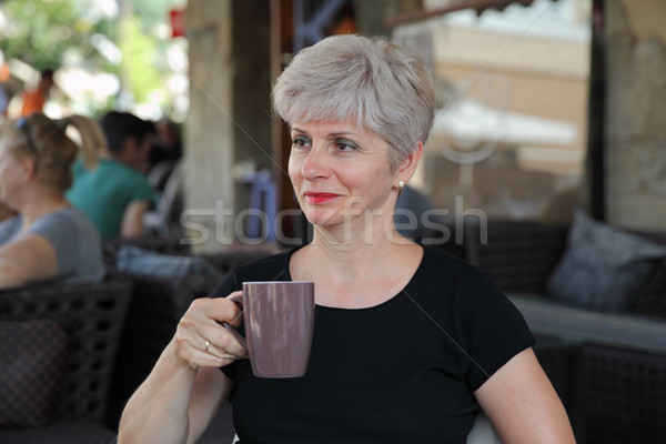 Woman in cafe drinking coffee Stock photo © simazoran