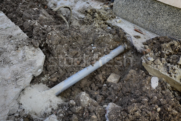 Stock photo: Sewerage tube repairing at construction site