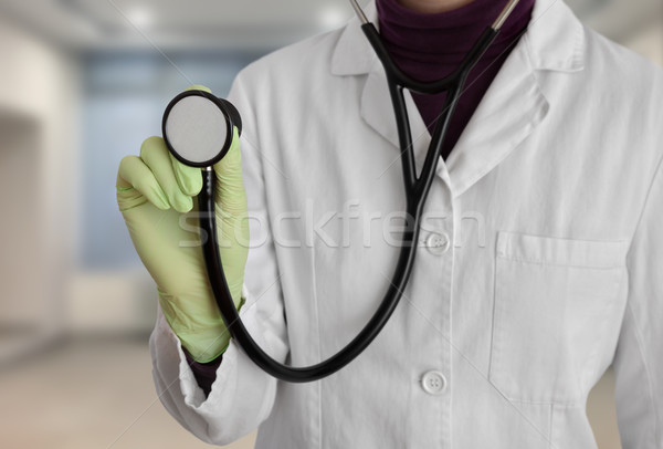 Doctor using stethoscope Stock photo © simazoran