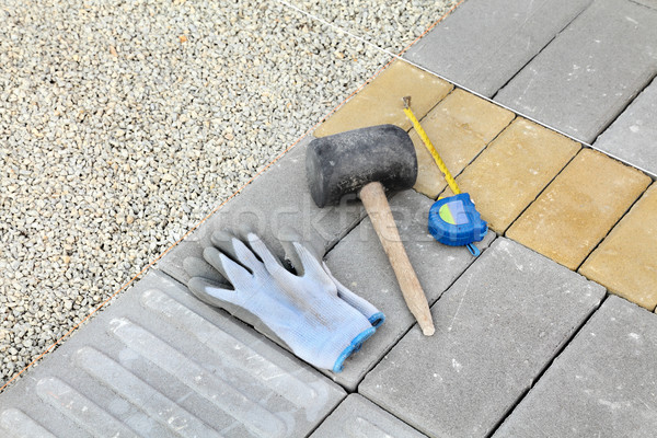 Stock photo: Construction site, brick paver and tools