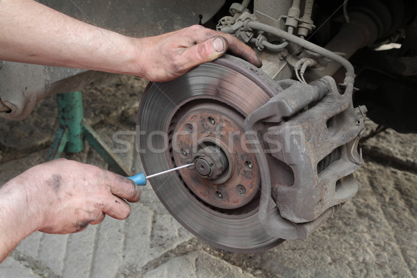 Car mechanic work on disc brakes Stock photo © simazoran