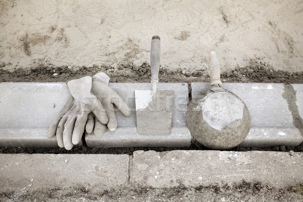 Stock photo: Construction site, curb stone and mason tools